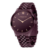 Die LIEBESKIND BERLIN Armbanduhr - The Classy ist eine kastanienbraune Metallarmbanduhr mit einem schlichten Zifferblatt, goldenen Zeigern, einem Edelstahlgehäuse und dem Liebeskind Berlin Branding.