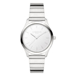 Die LIEBESKIND BERLIN Armbanduhr - The Round Staple hat ein minimalistisches weißes Ziffernblatt und ein silbernes Metallarmband - eine stilvolle Uhr von Liebeskind Berlin, perfekt für den eleganten Alltag.