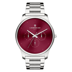 Die LIEBESKIND BERLIN Armbanduhr - Classic x Trends verfügt über ein silbernes Gehäuse, ein rotes Zifferblatt mit Tages- und Datumsanzeige und das Markenlogo - eine schicke, vom skandinavischen Design inspirierte Damenuhr.