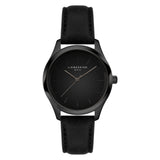 Die LIEBESKIND BERLIN Armbanduhr - Round Staple Leather verfügt über ein schwarzes Lederarmband und ein minimalistisches Zifferblatt, das modernes Design mit müheloser Eleganz von Liebeskind Berlin verbindet.