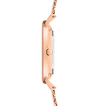 Seitenansicht der schlanken LIEBESKIND BERLIN Armbanduhr - Timeless Must Have von pro/concept Vermarktungs GmbH in Roségold, mit Metallband, minimalistischem Design und runder Krone.