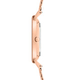 Seitenansicht der schlanken LIEBESKIND BERLIN Armbanduhr - Timeless Must Have von pro/concept Vermarktungs GmbH in Roségold, mit Metallband, minimalistischem Design und runder Krone.