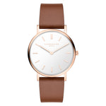 LIEBESKIND BERLIN Damenarmbanduhr in Roségold mit weißem Zifferblatt und braunem Lederarmband in der Vorderansicht.