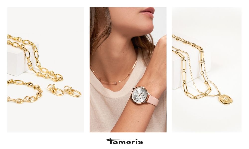 Tamaris Schmuck und Damenuhren: Goldfarbene Ketten und Creolen kombiniert mit eleganter Armbanduhr mit rosafarbenem Lederarmband – moderner Damenschmuck in stilvollem Design.