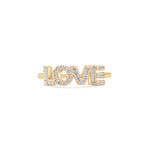 Tamaris Ring aus der Silver Love Collection mit "LOVE"-Schriftzug, dessen Buchstaben mit funkelnden Zirkoniasteinen verziert sind - präsentiert vor schlichtem Hintergrund.