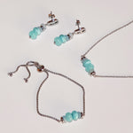 Tamaris Natural Stones Schmuck in Silber mit türkisfarbenen Perlen – Halskette, Armband und Ohrringe