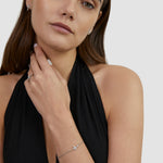 Tamaris Cross Armband in Silber mit funkelndem Zirkonia-Kreuz am Handgelenk getragen