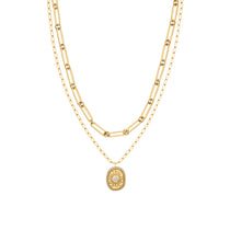 Goldfarbene Tamaris Layering-Halskette mit grober Gliederkette und feiner Kette mit ovalem Anhänger