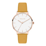 Tamaris Damen Armbanduhr mit roségoldfarbenem rundem Gehäuse, weißem Zifferblatt und senfgelbem Lederarmband in Frontansicht.