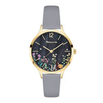 Die Tamaris Armbanduhr - Romantic Flowers von Tamaris hat ein goldenes Gehäuse, ein graues Armband und ein florales Design auf dem dunklen Zifferblatt mit goldenen Stundenmarkierungen - eine elegante Lederuhr, die zu jedem Anlass passt.