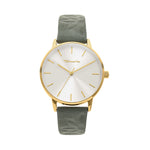 Die Tamaris Armbanduhr - Stamped Flowers von Tamaris verfügt über ein silbernes Zifferblatt, minimalistische Markierungen und ein schickes grünes Lederarmband mit dezentem Blattmuster - perfekt für stilvolle Outfits.